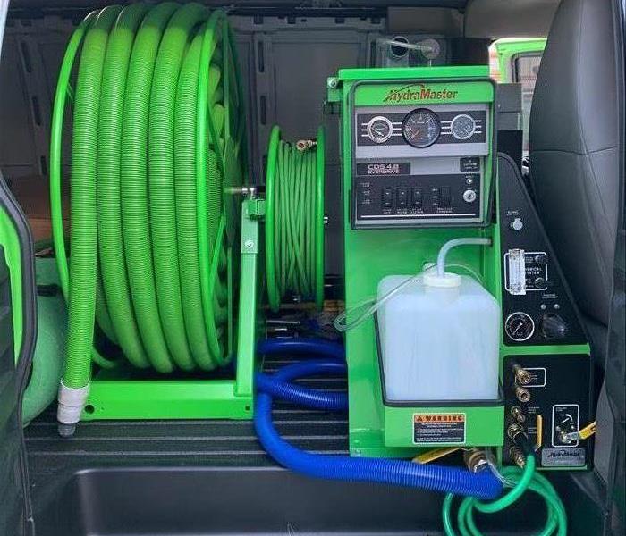 the back of a van with green equipment