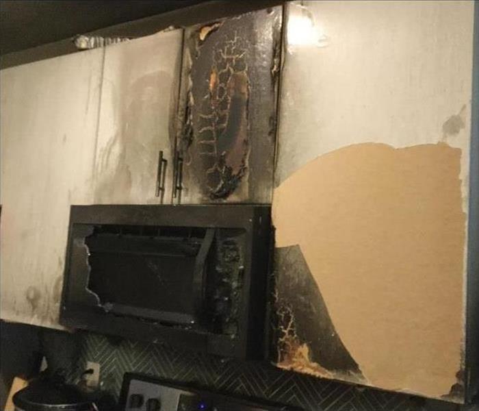 burned microwave in a kitchen
